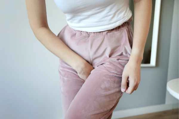 woman running for the toilet because of urinary incontinence Radlett